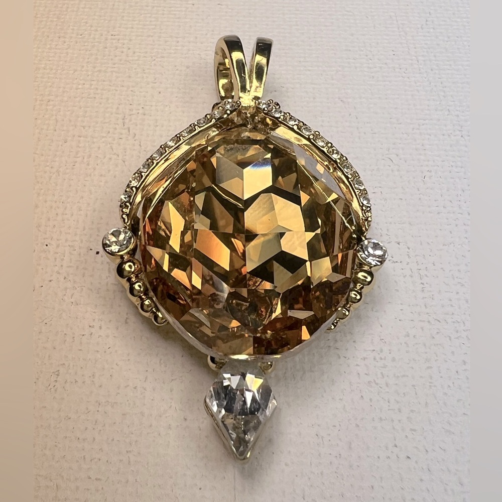 Eric Andrew’s Swarovski crystal pendant
